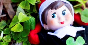 an elf on the shelf celebrating saint patricks day