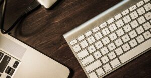 keyboard and computer on a desk