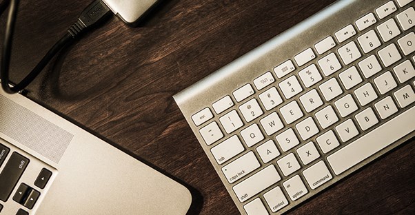 keyboard and computer on a desk