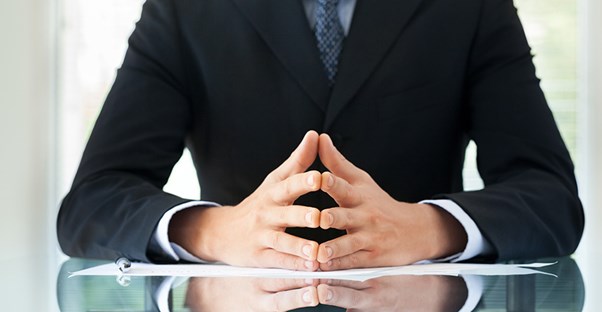 boss sitting at desk