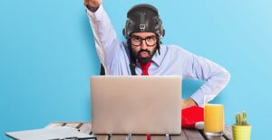 A new flier is excited that he has overcome his fear of flying after watching YouTube videos on his laptop.