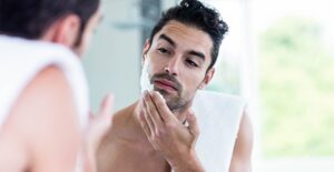 A man prepares to shave