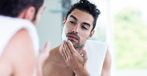 A man prepares to shave