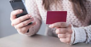 woman calling credit card company to freeze accounts after identity is stolen