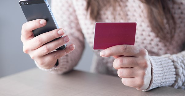 woman calling credit card company to freeze accounts after identity is stolen