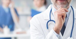 An embolism specialist touches his chin
