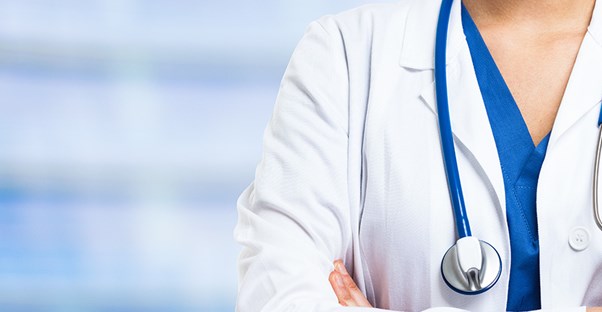 A doctor crosses her arms
