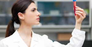 A doctor studies blood