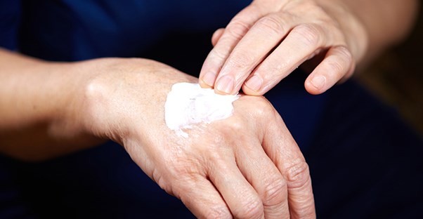 A woman treats age spots