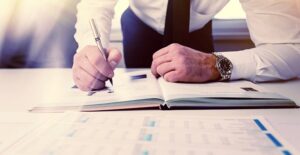 lawyer writing in a book