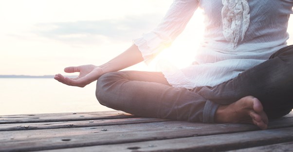 Young professional meditates after a long day at work
