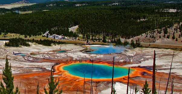 The Grand Prismatic Spring in Wyoming is shades of blue, green, orange, and yellow.