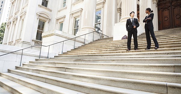 lawyers standing on court house steps