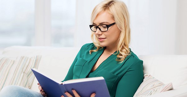 girl reading books about flipping houses