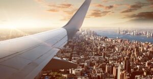 plane flying over city