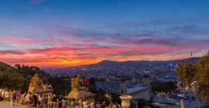 A Barcelona sunset creates beautiful colors on the horizon of the city.
