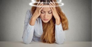 A woman experiences vertigo