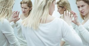 A woman fights with herself