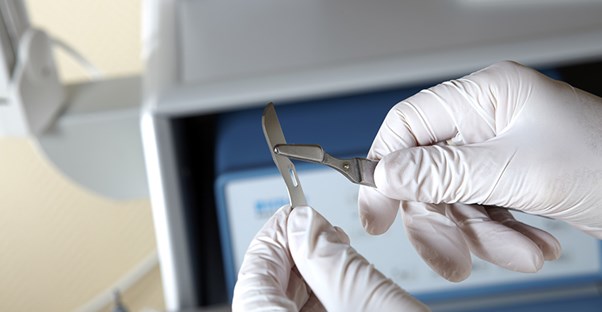 A plantar wart surgeon prepares