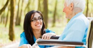 a nurse assists an aging alzheimers patient