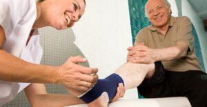 doctor treating pinched nerve in foot