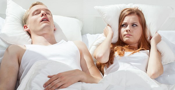 Man snoring in bed