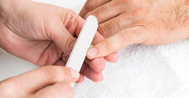 A guy getting a manicure
