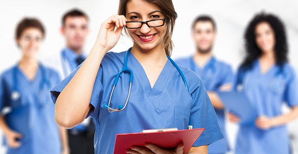 nursing school student smiling because she just got an awesome scholarship
