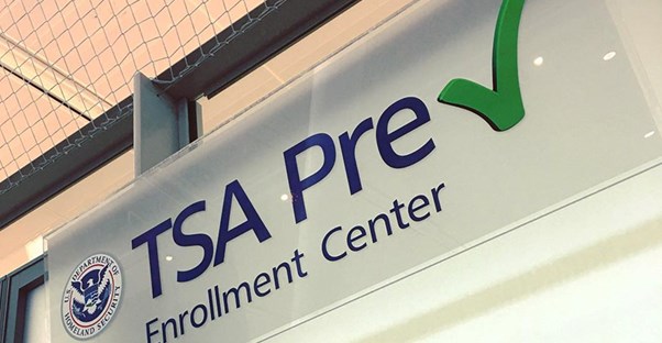 A TSA PreCheck sign hangs in an airport.