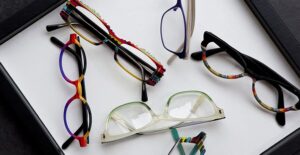 glasses sitting on a table to represent treatments for strabismus
