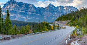 The Icefields Parkway in Canada is populated with tall mountains and winding roads.