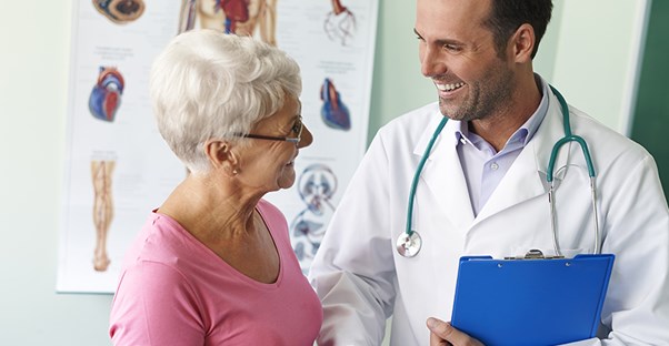 woman talking to her doctor about myofascial pain syndrome