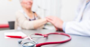 woman talking with doctor about her myofascial pain syndrome diagnosis