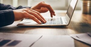 person on computer searching for online business loans