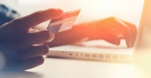 person trying to decide between using a bank or online lender for a personal loan