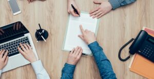 person interviewing different personal loan companies to find the best one