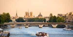 A boat floats down the Seine in Paris, France.