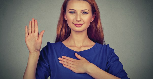 a woman signing a sign that she learned from the best sign language translator app