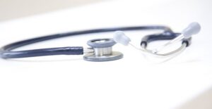 stethoscope on counter because doctor is checking for signs and symptoms of leprosy