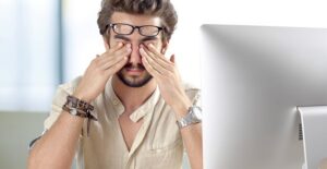guy rubbing his eyes because he is experiencing stye symptoms