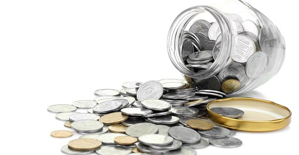 a jar with donations from a nonprofit fundraiser spilling out because their method was effective