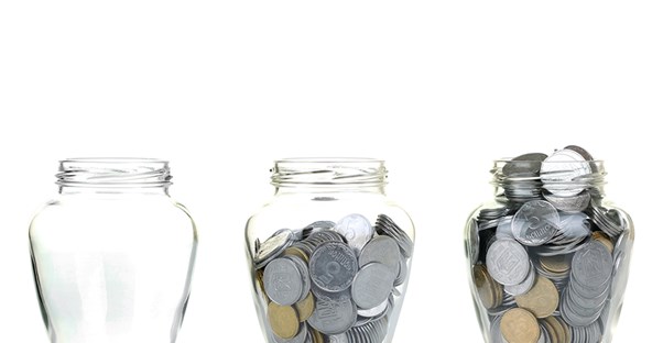 three change jars from three different fundraising events