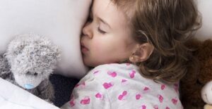 child sleeping and grinding their teeth