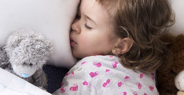 child sleeping and grinding their teeth