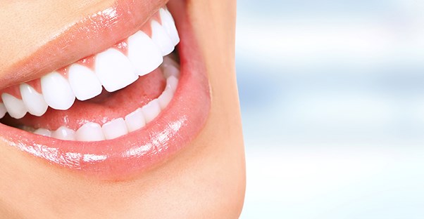 woman who is happy because she successfully treated her bruxism