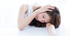 girl experiencing the symptoms of fatigue