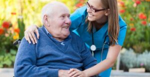 a nurse discusses blood sugar levels with an older patient