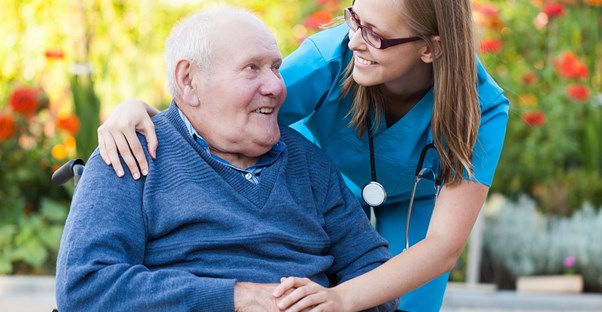 a nurse discusses blood sugar levels with an older patient