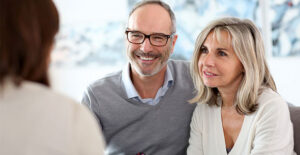 Couple speaking to an agent about life insurance