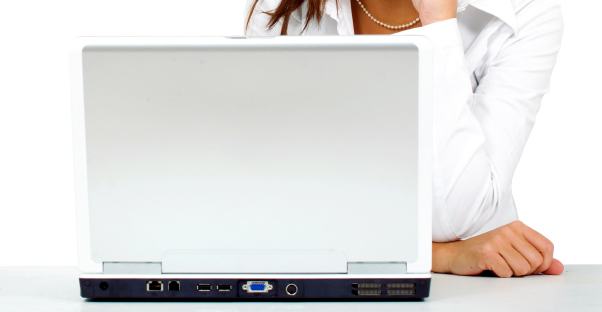 Woman researching life insurance on her laptop
